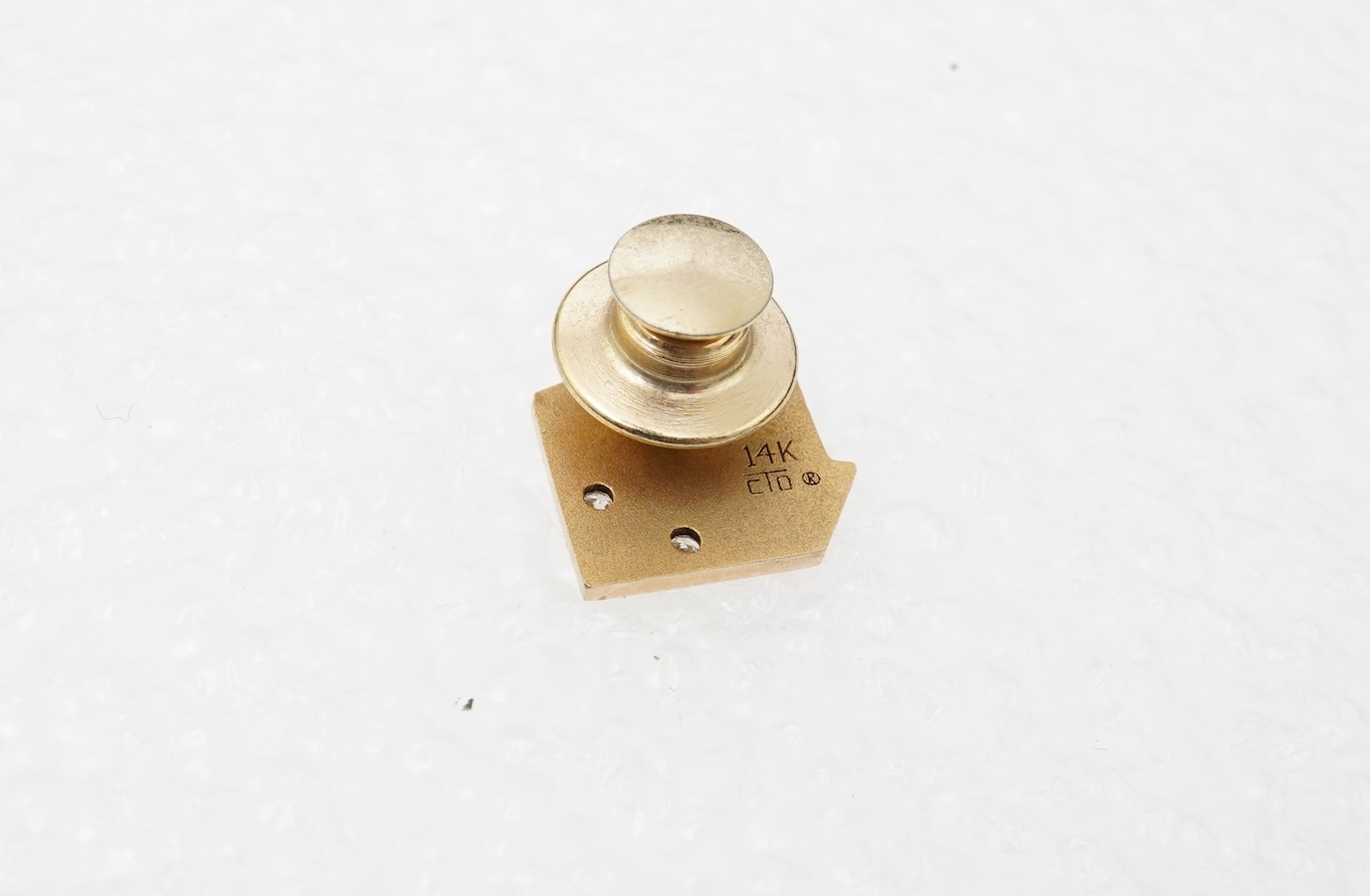 A gold and diamond novelty pin